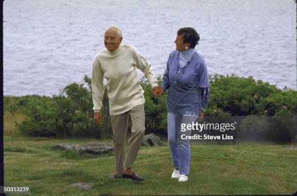 Artist Andrew Wyeth with his wife outside lighthouse that is their summer retreat.