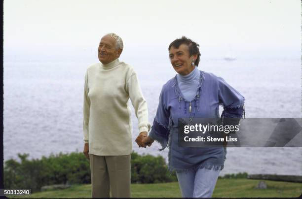 Artist Andrew Wyeth with his wife outside lighthouse that is their summer retreat.