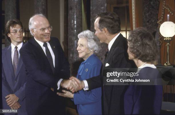 Vice President George H.W. Bush, re-enacting Senate swear in with Sen. Patrick J. Leahy and his family.