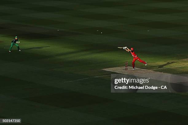 Cameron White of the Renegades hits the ball over Tom Triffit of the Stars to bring up his half century during the Big Bash League match between the...