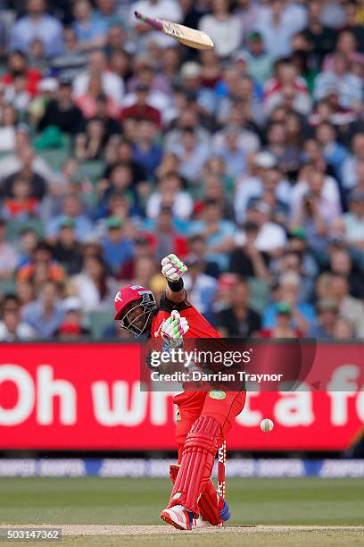 Dwayne Bravo of the Melbourne Renegades losers grip of his bat as his stumps are smashed by a delivery from John Hastings of the Melbourne Stars...
