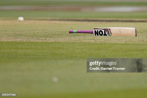 The bat of Dwayne Bravo of the Melbourne Renegades sits at mid wicket after he lost grip playing a shot during the Big Bash League match between the...