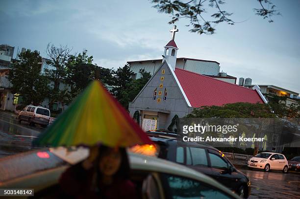Woman walks in front of a church in the city centre on January 2, 2016 in Hualien, Taiwan. The city of Hualien is the county seat of Hualien County,...