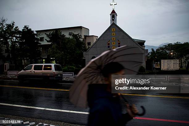 Hakka boys walks by a church in the city centre on January 2, 2016 in Hualien, Taiwan. The city of Hualien is the county seat of Hualien County,...