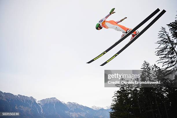 Peter Prevc of Slovenia soars through the air during his training jump on day 1 of the 64th Four Hills Tournament ski jumping event on January 2,...