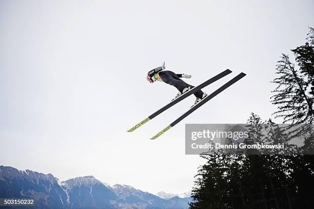 Severin Freund of Germany soars through the air during his training jump on day 1 of the 64th Four Hills Tournament ski jumping event on January 2,...