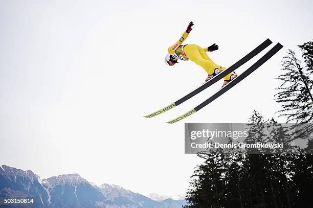 Kamil Stoch of Poland soars through the air during his training jump on day 1 of the 64th Four Hills Tournament ski jumping event on January 2, 2016...