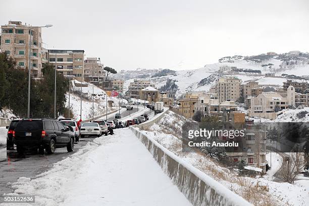 Cars queue up in traffic after security forces taking security measures in order to prevent accidents due to snow at Bhamdoun town in Beirut, Lebanon...