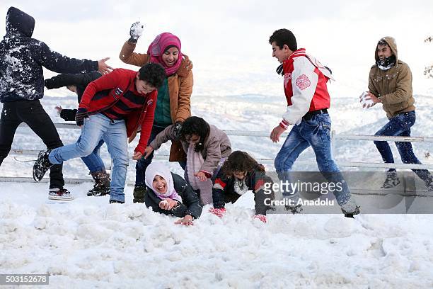 People play snowball at Bhamdoun town in Beirut, Lebanon on January 2, 2016.