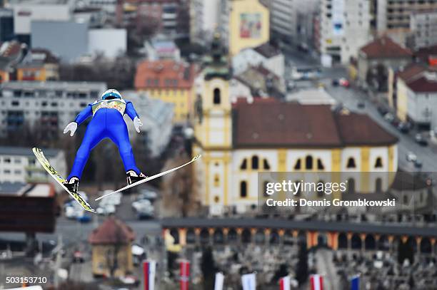Michael Hayboeck of Austria soars through the air during his training jump on day 1 of the 64th Four Hills Tournament ski jumping event on January 2,...