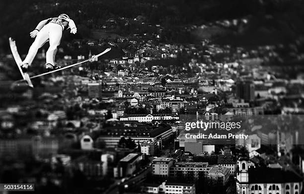 Kenneth Gagnes of Norway soars over Innsbruck during his qualification jump on Day 1 of the Innsbruck Four Hills Tournament on January 2, 2016 in...