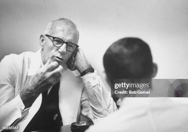 Pediatrician and author Dr. Benjamin M. Spock, talking to his colleague.