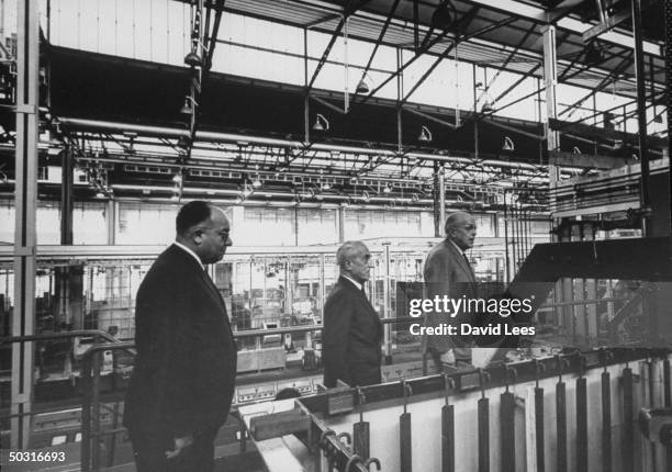 Gaudenzio Bobo , Vittorio Valletta , and Armando Fiorelli at assembly line for Fiat 500's plant.