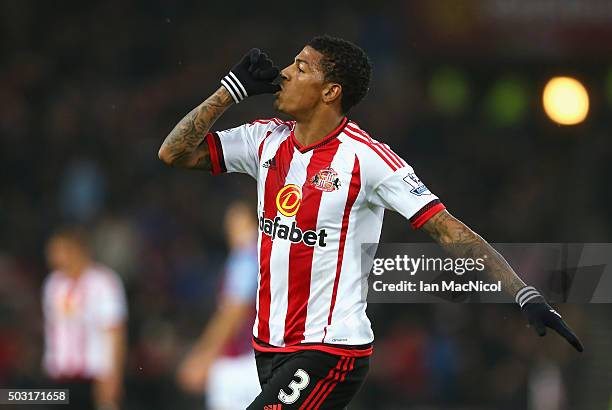 Patrick van Aanholt of Sunderland celebrates scoring his team's first goal during the Barclays Premier League match between Sunderland and Aston...