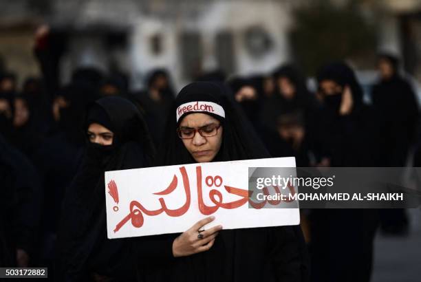 Bahraini woman takes part in a protest in the village of Jidhafs, west of Manama, against the execution of prominent Shiite Muslim cleric Nimr...