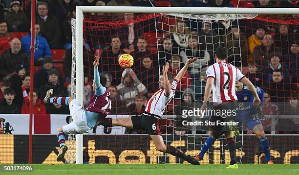 Carles Gil of Aston Villa scores his team's first goal during the Barclays Premier League match between Sunderland and Aston Villa at Stadium of...