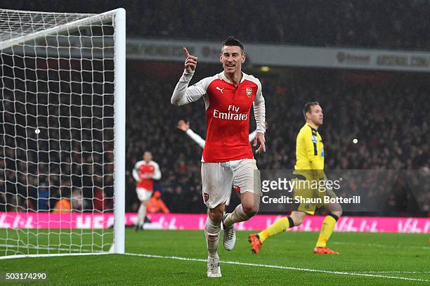 Laurent Koscielny of Arsenal celebrates scoring his team's first goal during the Barclays Premier League match between Arsenal and Newcastle United...