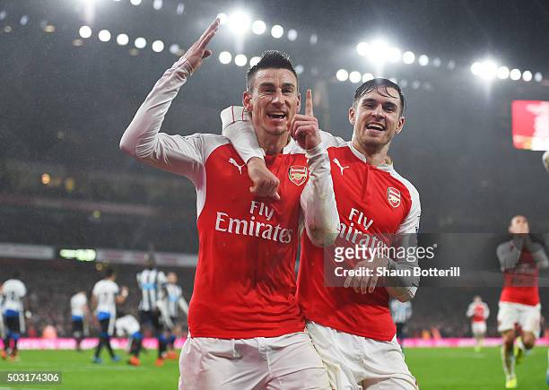 Laurent Koscielny of Arsenal celebrates scoring his team's first goal with his team mate Aaron Ramsey during the Barclays Premier League match...