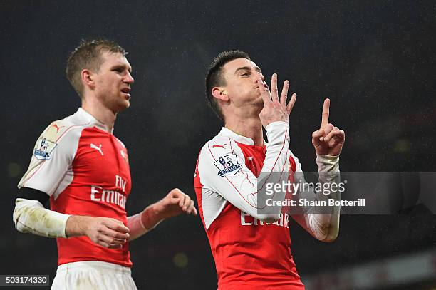 Laurent Koscielny of Arsenal celebrates scoring his team's first goal with his team mate Per Mertesacker during the Barclays Premier League match...