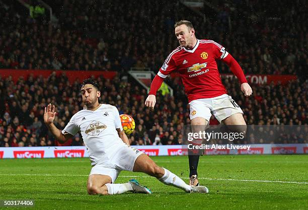 Wayne Rooney of Manchester United scores his team's second goal during the Barclays Premier League match between Manchester United and Swansea City...