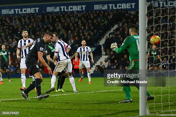 Jonathan Walters of Stoke City scores his team's first goal past Boaz Myhill of West Bromwich Albion during the Barclays Premier League match between...
