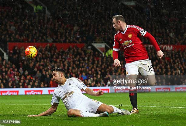 Wayne Rooney of Manchester United scores his team's second goal during the Barclays Premier League match between Manchester United and Swansea City...