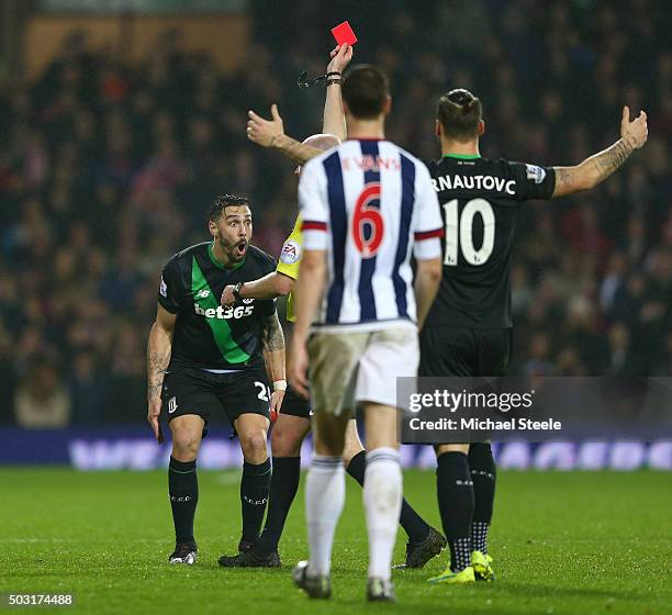 Geoff Cameron of Stoke City reacts after being shown a red card by referee Lee Mason during the Barclays Premier League match between West Bromwich...