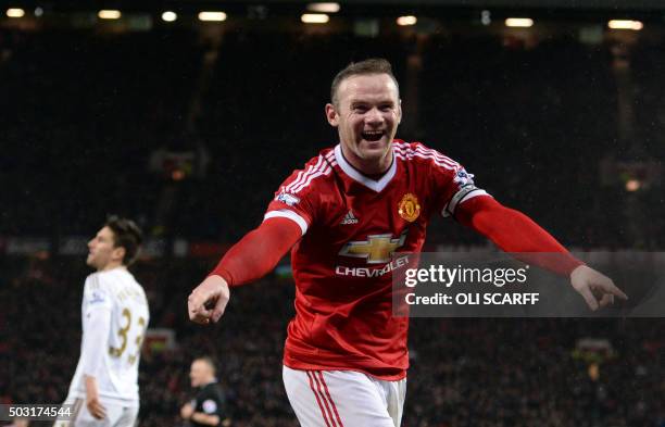 Manchester United's English striker Wayne Rooney celebrates scoring his team's second goal during the English Premier League football match between...