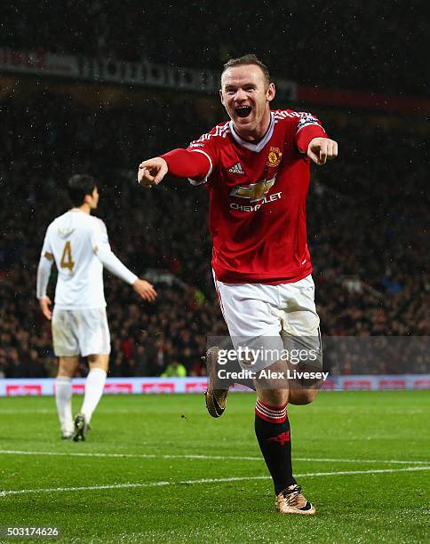 Wayne Rooney of Manchester United celebrates scoring his team's second goal during the Barclays Premier League match between Manchester United and...