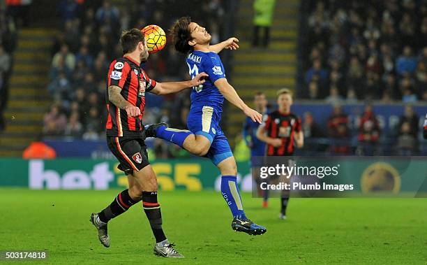 Shinji Okazaki of Leicester in action with Steve Cook of Bournemouth during the Barclays Premier League match between Leicester City and Bournemouth...