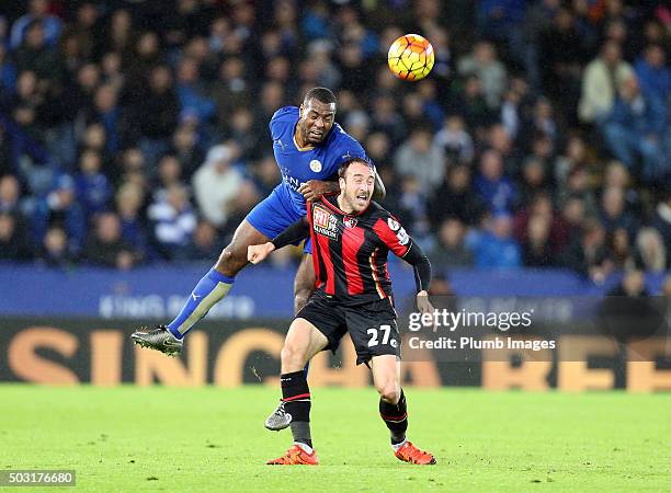 Wes Morgan of Leicester City in action with Glenn Murray of Bournemouth during the Barclays Premier League match between Leicester City and...