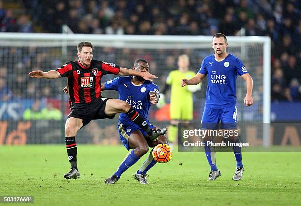Wes Morgan of Leicester City in action with Dan Gosling of Bournemouth during the Barclays Premier League match between Leicester City and...