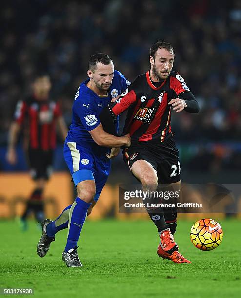 Glenn Murray of Bournemouth and Danny Drinkwater of Leicester City compete for the ball during the Barclays Premier League match between Leicester...