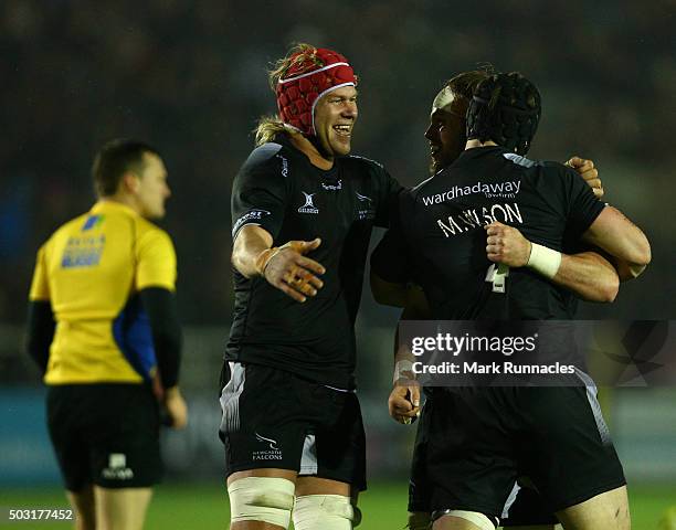 Will Welch , Mark Wilson and Mouritz Botha of Newcastle Falcons celebrate at the final whistle as their side won 19-14 over Bath Rugby during the...