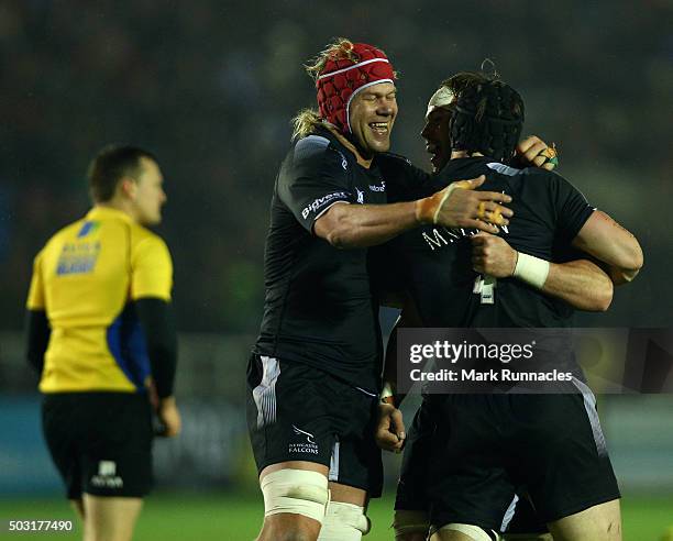 Will Welch , Mark Wilson and Mouritz Botha of Newcastle Falcons celebrate at the final whistle as their side won 19-14 over Bath Rugby during the...