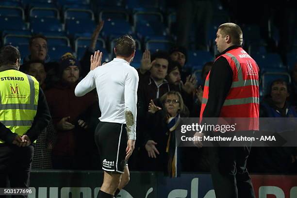 Liam Lawrence of Shrewsbury Town apologises to the traveling fans after the 7-1 defeat during the Sky Bet League One match between Chesterfield and...