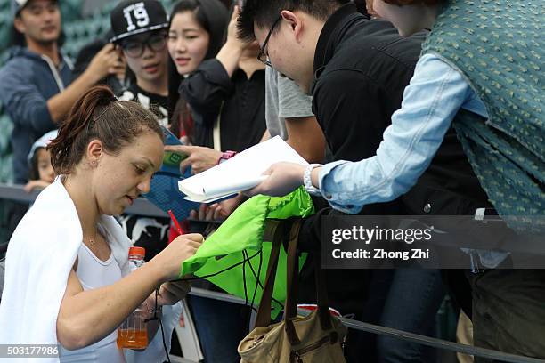 Patricia Maria Tig of Romania sign autograph for fans after her match against Lidziya Marozava of Belarus Republic during the WTA Shenzhen Open...