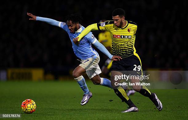 Raheem Sterling of Manchester City battles for the ball with Etienne Capoue of Watford during the Barclays Premier League match between Watford and...