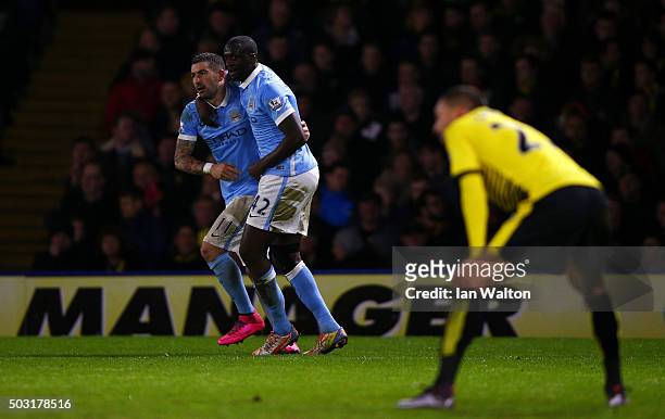 Yaya Toure of Manchester City celebrates with Aleksandar Kolarov of Manchester City after scoring his side's first goal during the Barclays Premier...