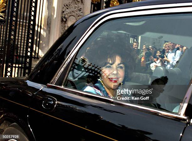Actress Elizabeth Taylor being driven fr. Buckingham Palace.
