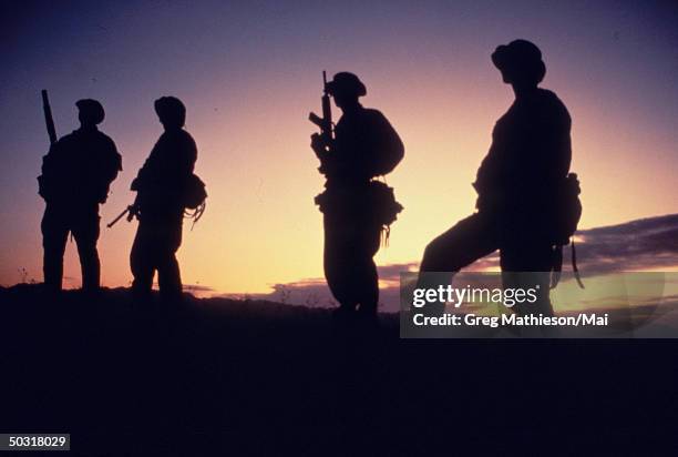 Silhouettes of Navy SEAL team, part of US Special Forces.