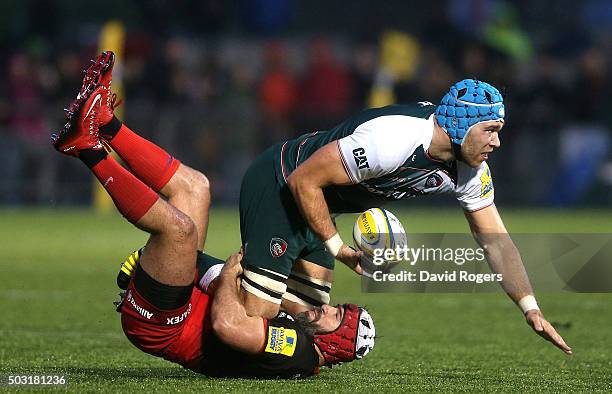 Graham Kitchener of Leicestser is tackled by Schalk Brits during the Aviva Premiership match between Saracens and Leicester Tigers at Allianz Park on...