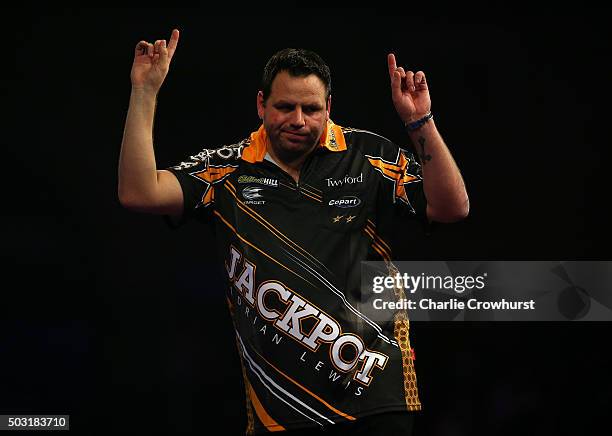 Adrian Lewis of England celebrates after winning his semi-final match against Raymond van Barneveld of the Netherlands during the 2016 William Hill...