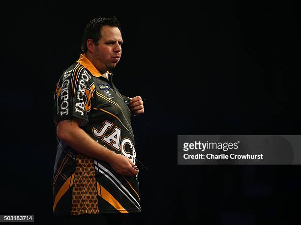 Adrian Lewis of England celebrates after winning his semi-final match against Raymond van Barneveld of the Netherlands during the 2016 William Hill...