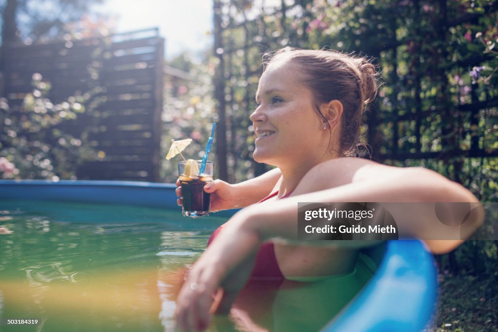 Woman relaxing in pool.