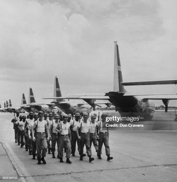 Troops from the 101 Airborne Division 506 Battle Ground drilling on the airfield.