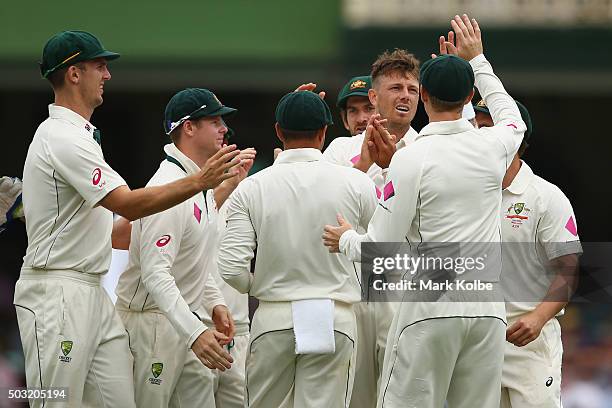 James Pattinson of Australia celebrates after taking the wicket of Darren Bravo of West Indies during day one of the third Test match between...