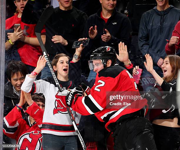 John Moore of the New Jersey Devils celebrates his game winning goal in overtime against the Dallas Stars on January 2,2016 at Prudential Center in...