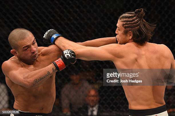 Diego Brandao of Brazil punches Brian Ortega in their featherweight bout during the UFC 195 event inside MGM Grand Garden Arena on January 2, 2016 in...