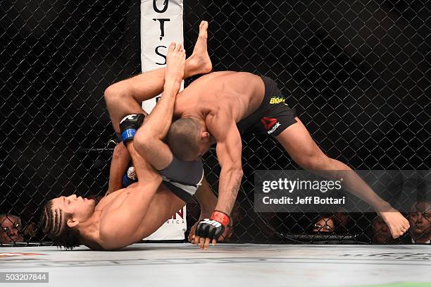 Brian Ortega attempts to submit Diego Brandao of Brazil in their featherweight bout during the UFC 195 event inside MGM Grand Garden Arena on January...